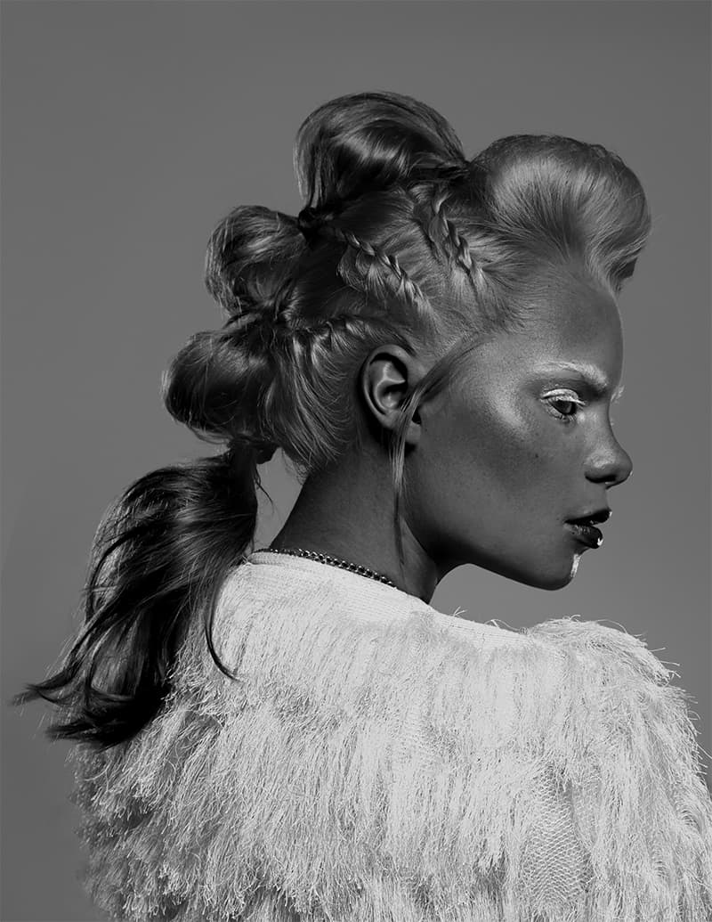 gray image of a girl with a cool haircut