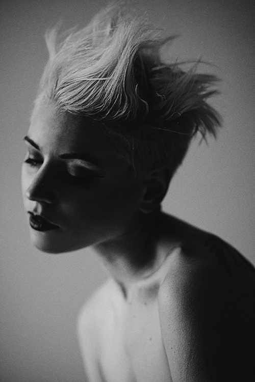 Black and white photo of a girl with short blue hair