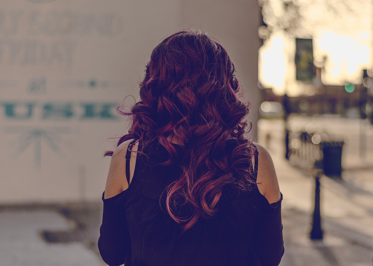 Photo of a red hair girl from behind